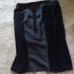 Damaged lip service cross skirt in velvet like material.